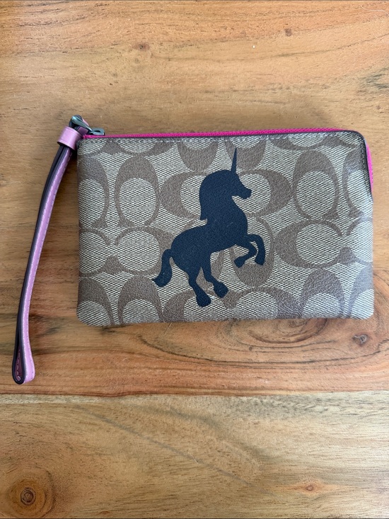 Coach Handbags - NWOT Coach Zip Wristlet in Signature Canvas with Unicorn Motif